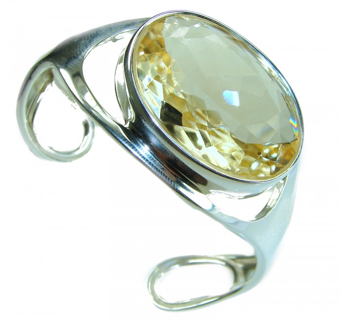 Simplicity 85.5 carat Genuine Lemon Quartz handcrafted .925 Sterling Silver Bracelet / Cuff - Silver bracelet with large lemon quartz, angled view showing stone detail.