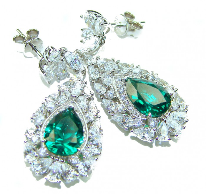 Giovanna - Authentic 8.9 carat Emerlad .925 Sterling Silver handcrafted earrings - Emerald and diamond earrings close-up on white background.