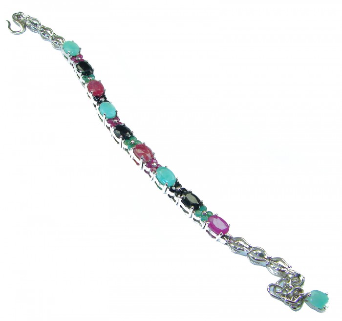 Tiffany 26.8 caratVCOLOMBIAN EMERALD Ruby Sapphire .925 Sterling Silver handcrafted Bracelet - Side view of a multicolored gemstone bracelet with silver chain.