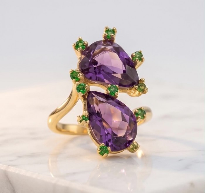 Purple Royalty 8.5 carat Amethyst .925 Sterling Silver dipped in 18K Gold over Handcrafted Ring size 6 1/4 - Close-up of double teardrop amethyst ring with green accents on marble.