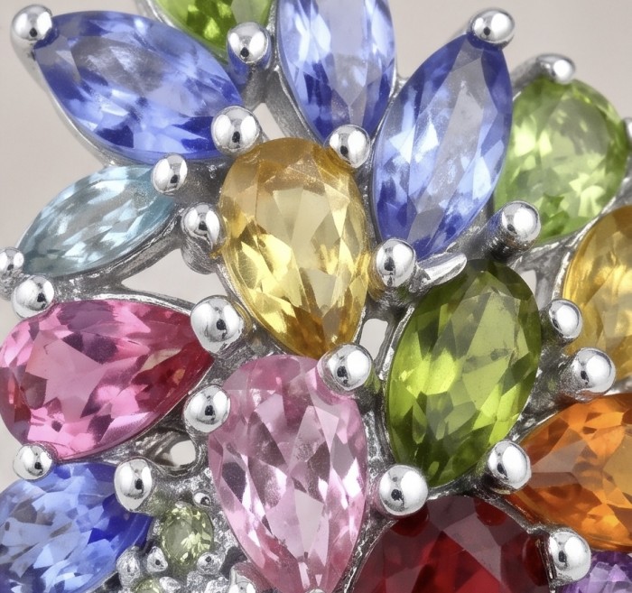 Exquisite 15.2 ctw Mozambique Ruby Multigem rhodium over .925 Sterling Silver handcrafted Statement Ring size 8 - Close-up of multicolored gemstones in rhodium setting.
