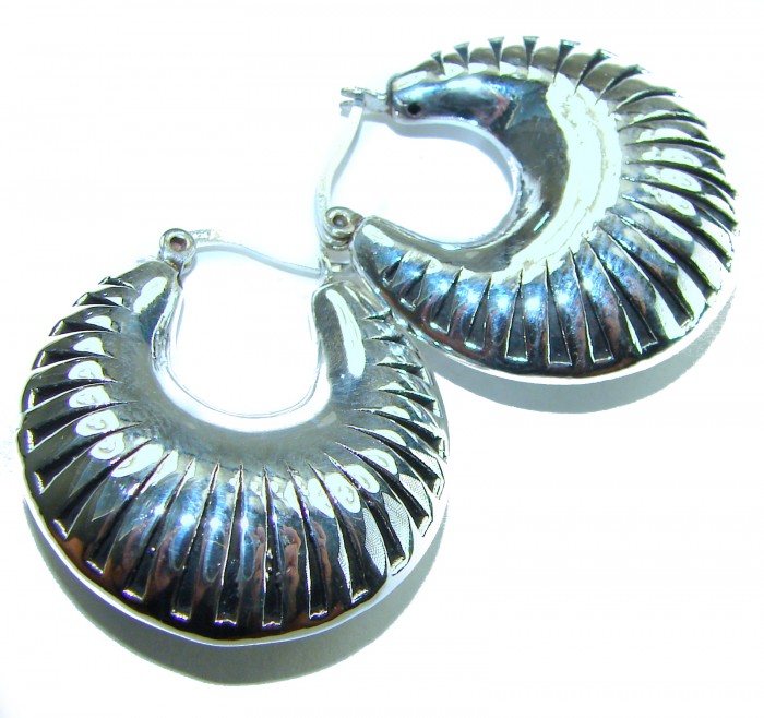 Highly Polished Fancy Modern design .925 Sterling Silver Italy made Earrings - Close-up of polished sterling silver hoop earrings with textured design.