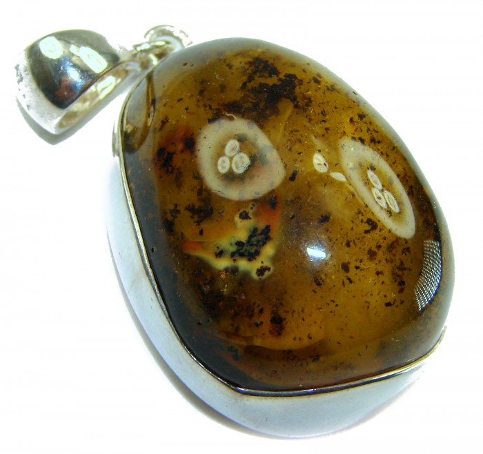 Prehistoric Authentic Baltic Amber .925 Sterling Silver beautifully handcrafted Pendant - Close-up of prehistoric Baltic amber pendant in sterling silver setting.