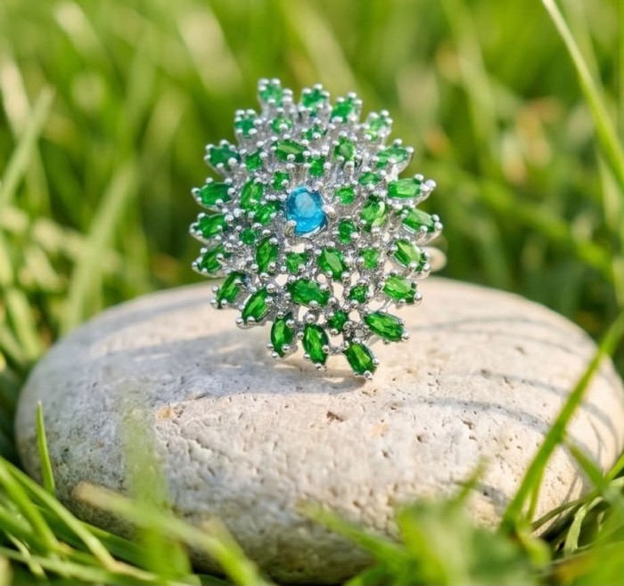 Fiammetta oval cut 2.2 carat Paraiba Tourmaline Tsavorite Garnet .925 Sterling Silver entirely handmade Ring size 8 - Close-up of Fiammetta ring with Paraiba Tourmaline and Tsavorites on stone.