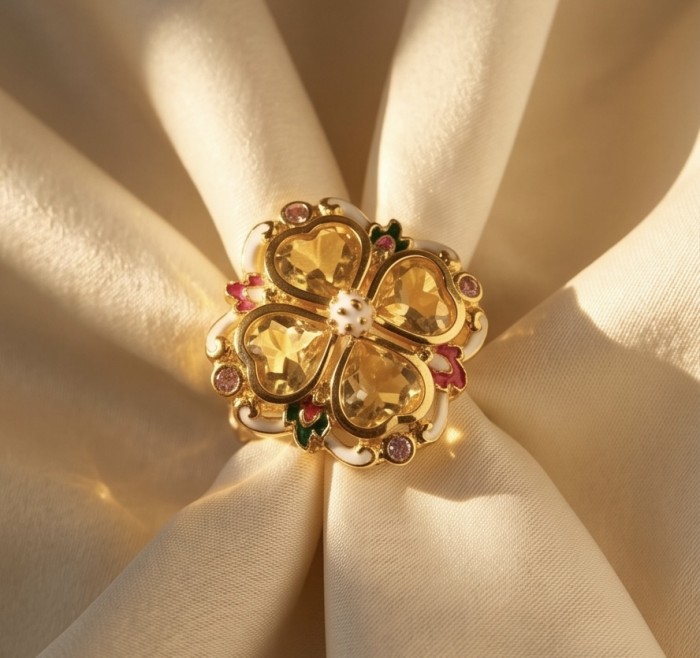 Yellow Clover 10.2 carat Brazilian Citrine Enamel .925 Sterling Silver dipped in real 22K Gold handcrafted HUGE ring; s. 7 - Close-up of Yellow Clover Citrine Enamel Jewelry on Beige Fabric