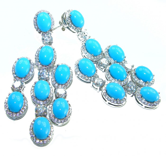 Great quality authentic Sleeping Beauty Turquoise 18K Whute Gold over .925 Sterling Silver handcrafted Earrings - Blue gemstone earrings, close-up, showcasing intricate silver settings.