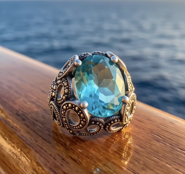 Massive Deep Blue 25.8 carat Aquamarine Marcasite .925 Sterling Silver handcrafted ring size 9 - Aquamarine ring close-up on wooden surface, ocean in background.