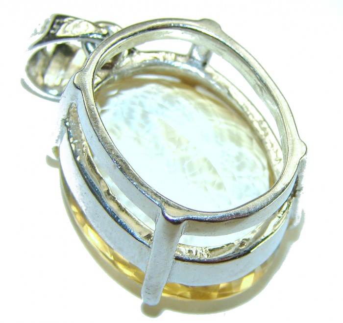 Perfection Oval cut 23.3 carat Lemon Quartz .925 Sterling Silver handcrafted pendant - Close-up of oval cut lemon quartz in sterling silver setting.