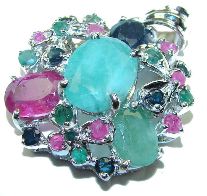Spectacular 12.8 carat authentic Colombian Emerald .925 Sterling Silver handcrafted Pendant - Close-up of colorful gemstone cluster featuring Colombian emeralds.