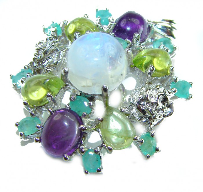 Genuine 6.2 carat Fire Moonstone .925 Sterling Silver handcrafted pendant - Close-up of multicolored gemstone cluster on sterling silver jewelry.