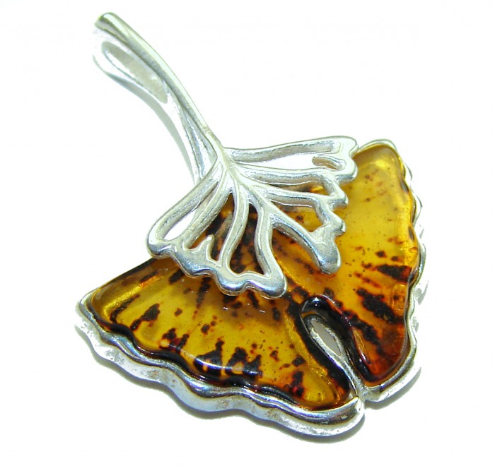 Sea Treasure Prehistoric Authentic Butterscotch Baltic Amber .925 Sterling Silver beautifully handcrafted Pendant - Ginkgo leaf pendant, close-up showing amber and silver details.