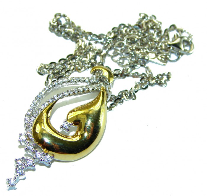 Elegance 4.2 carat White Topaz 14K Gold over .925 Sterling Silver handcrafted necklace - Gold and silver pendant with white topaz, chain entwined, top view.