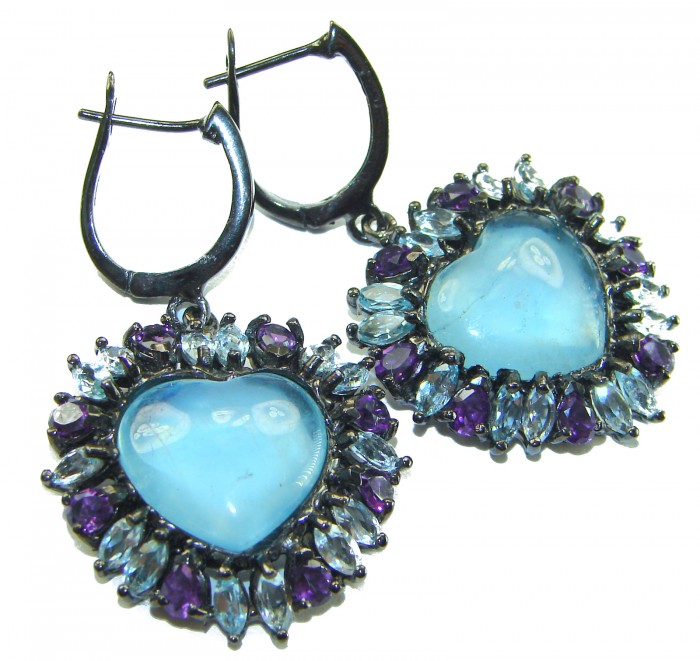 A Heritage in Bloom 12.5 carat Aquamarine black rhodium over .925 Sterling Silver handmade Large Statement Earrings - Heart-shaped aquamarine earrings with purple and blue stones close-up.