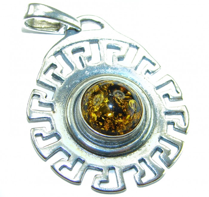Prehistoric Authentic Baltic Amber .925 Sterling Silver beautifully handcrafted Pendant - Close-up of Baltic amber pendant with intricate silver design.