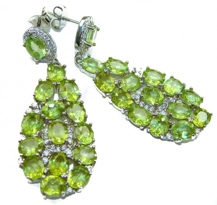 Fiesta Authentic 27.5 carat Peridot .925 Sterling Silver brilliantly handcrafted Statement earrings - Green peridot earrings, front view showcasing stones and silver setting.