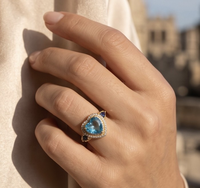 ANGEL'S HEART 6.8 carat Swiss Blue Topaz .925 Sterling Silver dipped in 22K Gold handcrafted ring size 8 - Swiss Blue Topaz heart ring worn on hand, close-up view