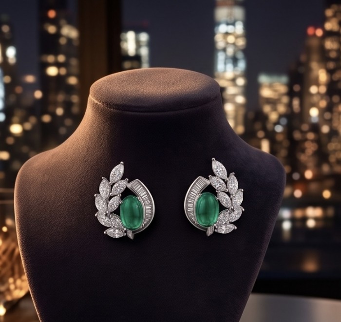 Luxurious - 7.2 carat Colombian Emerald .925 Sterling Silver dipped in rhodium handmade Statement Earrings - Colombian Emerald earrings on display, city lights in background.