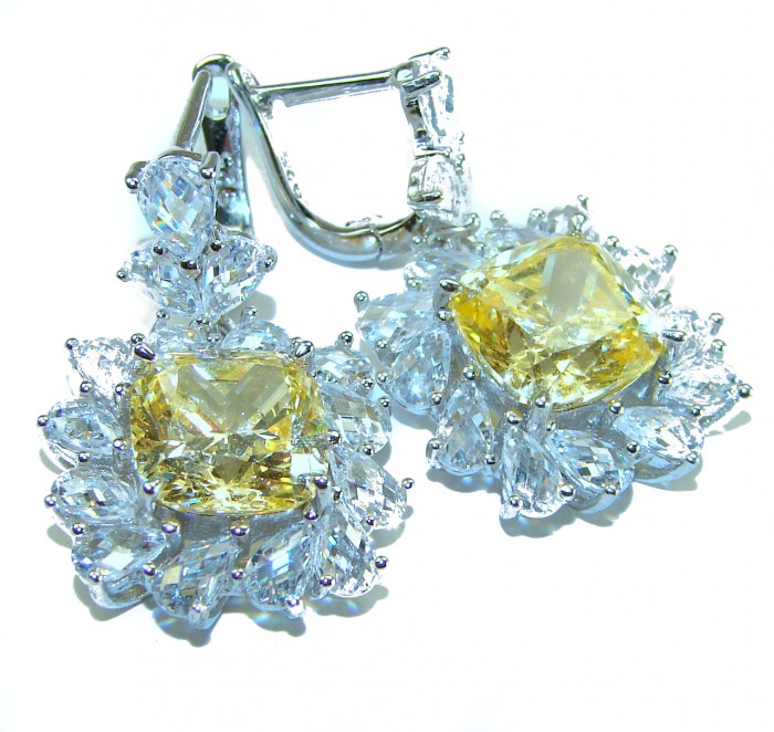 15.5 carat Golden - yellow Montana Sapphire .925 Sterling Silver handcrafted earrings - Close-up of 15.5 carat yellow sapphire earrings on sterling silver.