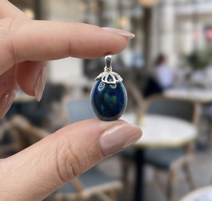 Mystery 10.8 CTW Authentic Black Opal 14K Gold over .925 Sterling Silver handmade Pendant - Close-up of a black opal pendant held between fingers.