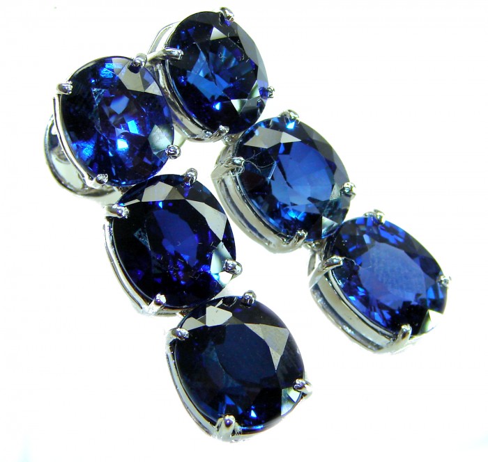 Deep Ocean 22.5 carat London Blue Topaz .925 Sterling Silver handmade Statement earrings - Close-up of deep blue topaz earrings in sterling silver settings.