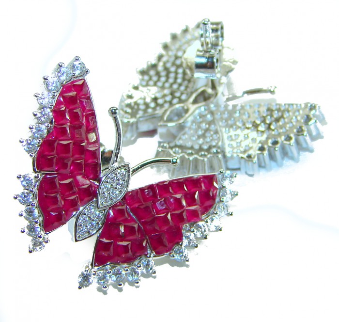 Real Beauty natural 11.9 carat Ruby Butterflies .925 Sterling Silver handcrafted earrings - Close-up of butterfly-shaped ruby and diamond earrings in silver.