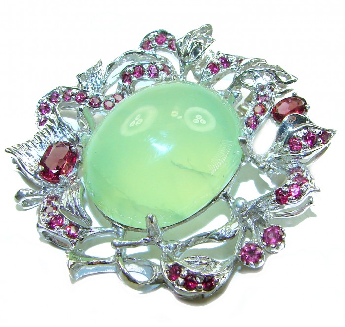 Royal quality genuine 32.5 carat Prehnite from South Africa rhodium over .925 Sterling Silver handcrafted Pendant Brooch - Intricate brooch with prehnite and pink stones, top view close-up.