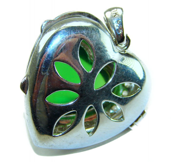 Secret compartment Authentic 18.5 carat Green Helenite .925 Sterling Silver Pendant - Heart-shaped locket close-up, green stone visible through cutouts.