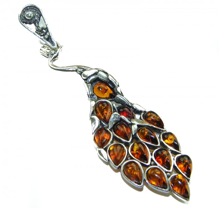 2 3/4 inches! Peacock Prehistoric Authentic Baltic Amber .925 Sterling Silver beautifully handcrafted Pendant - Peacock design pendant with Baltic amber stones, side view.