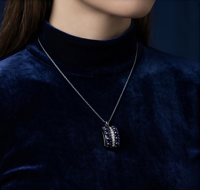 Born to Glam 7.2 carat natural Sapphire black rhodium over .925 Sterling Silver Perfectly handcrafted Pendant - Sapphire pendant worn on neck, close-up view. Velvet backdrop.