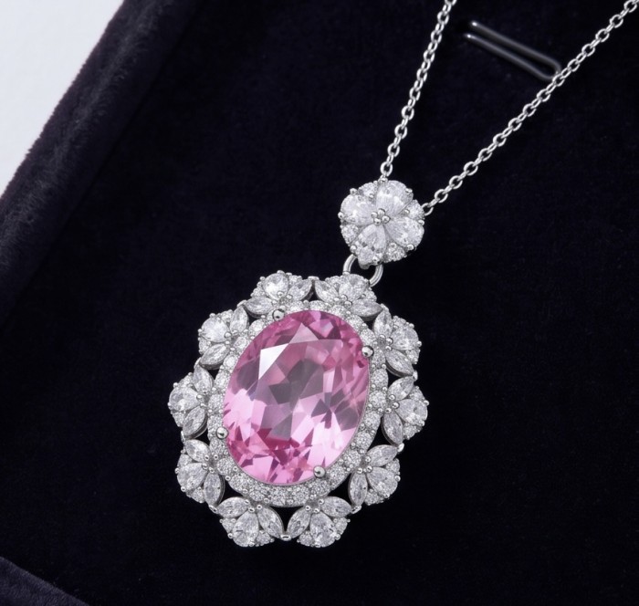 Tiffany Incredible oval cut 20.4 carat Pink Sapphire .925 Sterling Silver handcrafted pendant - Close-up of oval cut pink sapphire pendant with diamond accents.