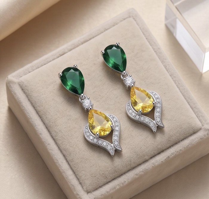 6.8 carat pearl cut Topaz rhodium over .925 Sterling Silver Handcrafted Statement earrings - Topaz and green stone earrings on display, front view.