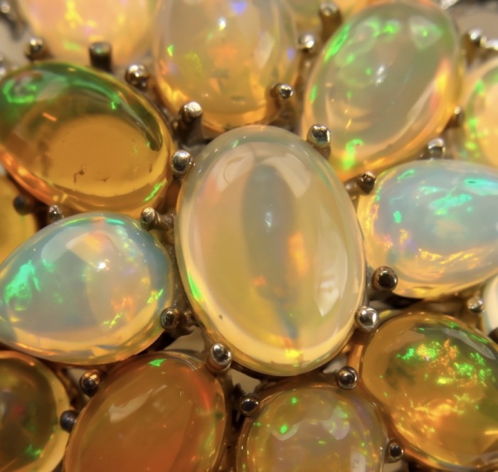 Black Label Collection Genuine 24.8 carat Fire Ethiopian Opal .925 Sterling Silver dipped in rhodium handmade Pendant - Brooch - Close-up of Ethiopian opals in jewelry setting.