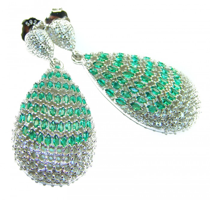 Magnificent Jewel - 17.5 carat natural EMERALD RHODIUM over .925 Sterling Silver handcrafted incredible earrings - Close-up of emerald-studded teardrop earrings with silver details.