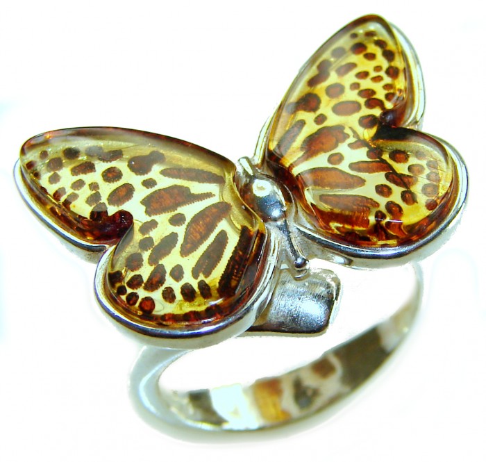 Butterfly Authentic carved Baltic Amber .925 Sterling Silver handcrafted ring; s. 8 adjustable - Close-up of butterfly-shaped amber and silver ring.