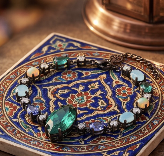 Victoria - Authentic 12.7 CARAT natural Colombian Emerald .925 Sterling Silver dippedin black rhodium handcrafted Statement bracelet - Bracelet with Colombian emerald, top view display on intricate tile.