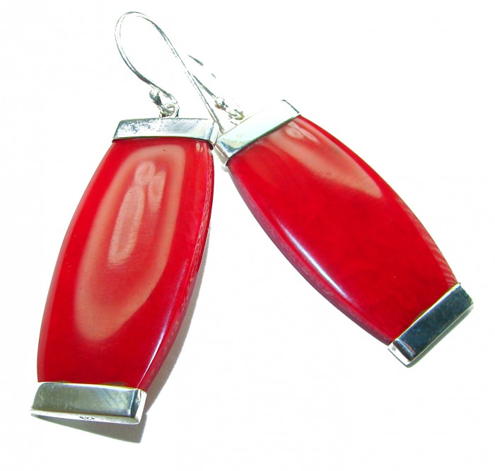 Large Genuine Red Fossilized Coral .925 Sterling Silver handmade earrings - Red fossilized coral earrings with silver accents, side view.