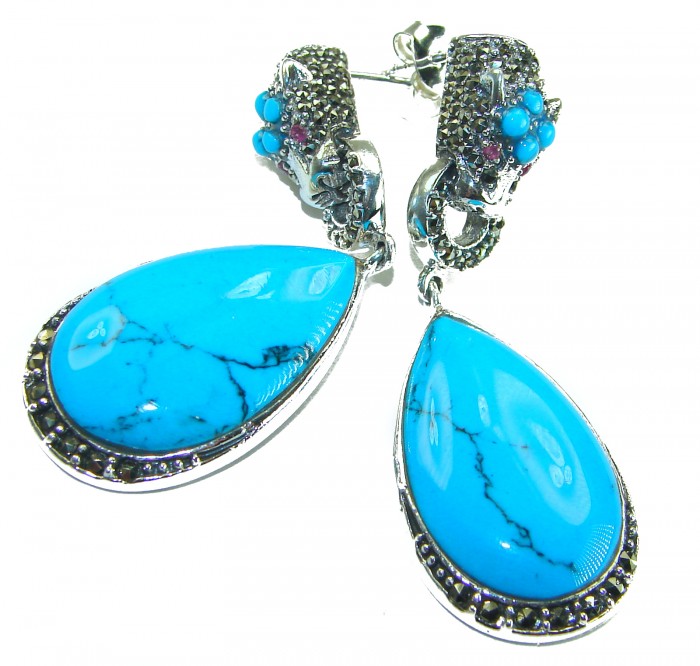 Great authentic Sleeping Beauty Turquoise .925 Sterling Silver handcrafted STATEMENT Earrings - Close-up of drop earrings with blue turquoise stones and silver detailing