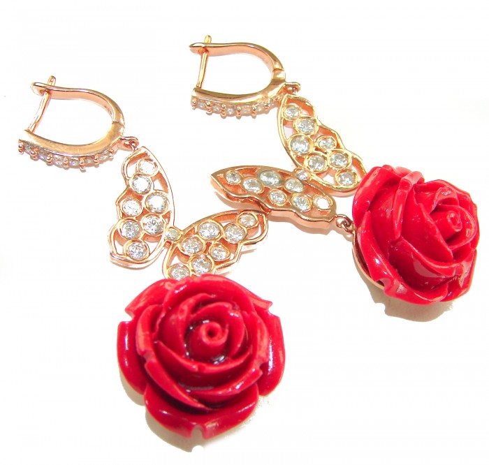 Enchanted Rose Genuine carved Coral 14K Rose Gold over .925 Sterling Silver handcrafted earrings - Rose gold earrings with butterfly detail and red rose, close-up view.