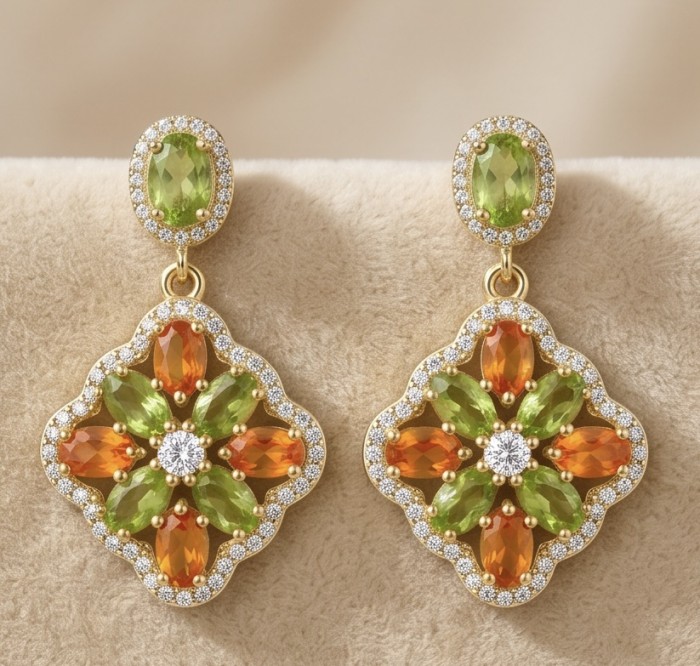 Giovanna - Genuine 4.6 carat orange Sapphire 22K Gold over .925 Sterling Silver handcrafted Statement Earrings - Close-up of Giovanna earrings with orange sapphires and green gemstones.