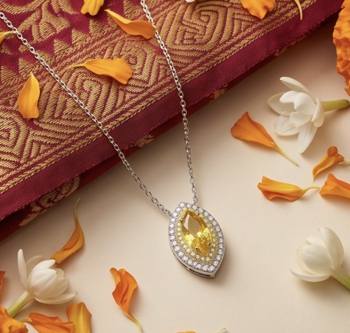 Luxurious marquise cut 10.5 carat Yellow Sapphire rhodium over .925 Sterling Silver handcrafted necklace - Marquise cut yellow sapphire pendant with floral accents, top view.