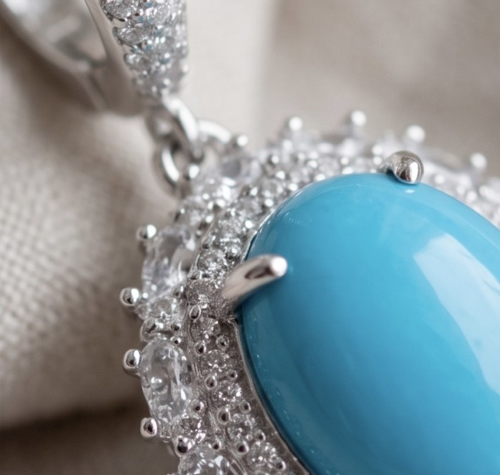 Authentic Sleeping Beauty Turquoise RHODIUM over .925 Sterling Silver handcrafted Statement Earrings - Close-up of turquoise stone with diamond accents in sterling silver setting.