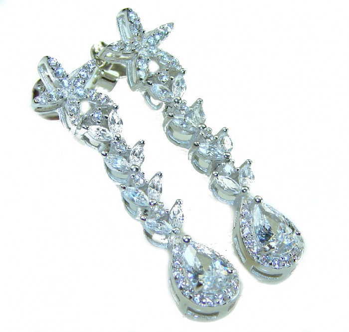 Precious genuine 7.9 carat White Sapphire .925 Sterling Silver handcrafted earrings - Close-up of sparkling white sapphire drop earrings on sterling silver.
