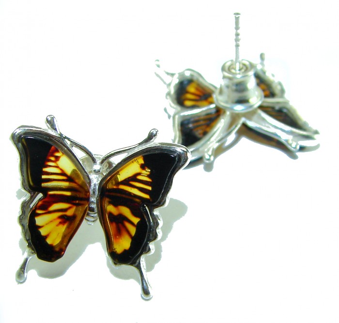 Butterflies carved Baltic Polish Amber .925 Sterling Silver earrings - Butterfly amber earrings in sterling silver, angled view.