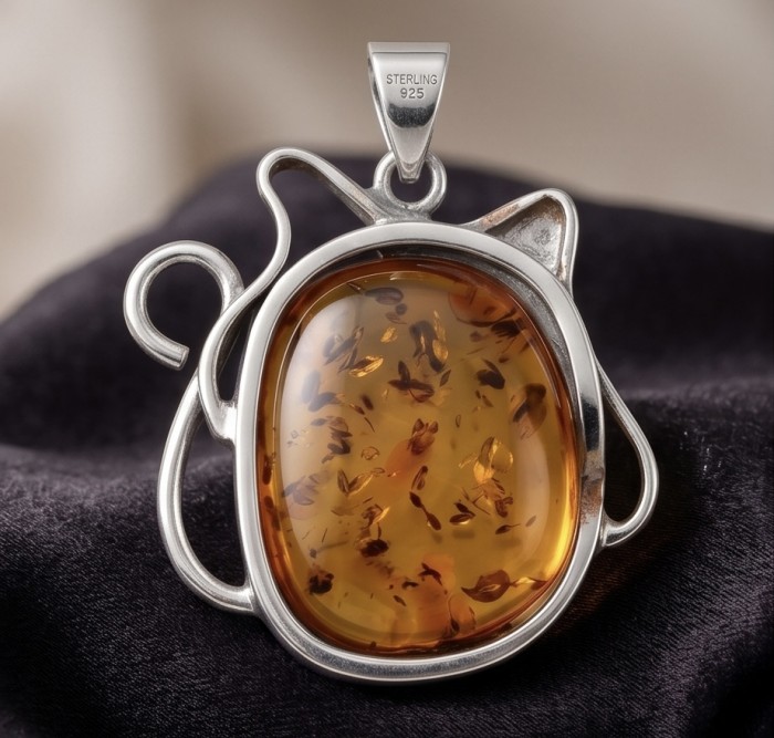 Cat - Prehistoric Authentic Baltic Amber .925 Sterling Silver beautifully handcrafted Pendant - Amber pendant with cat design in sterling silver, front view.