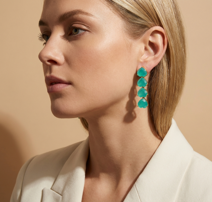 Giovanna - Authentic 21.9 carat Colombian Emerlad .925 Sterling Silver dipped in 22K Gold handcrafted earrings - Side view of woman wearing Giovanna emerald earrings.