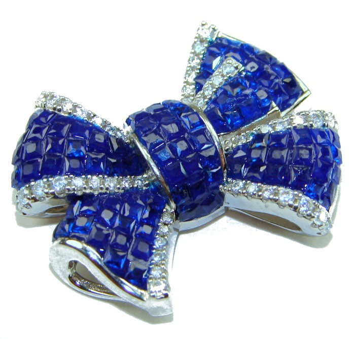 Heirloom blue Bow Genuine 17.5 carat Sapphire .925 Sterling Silver handmade Pendant - Blue sapphire bow brooch with diamond accents, top view.