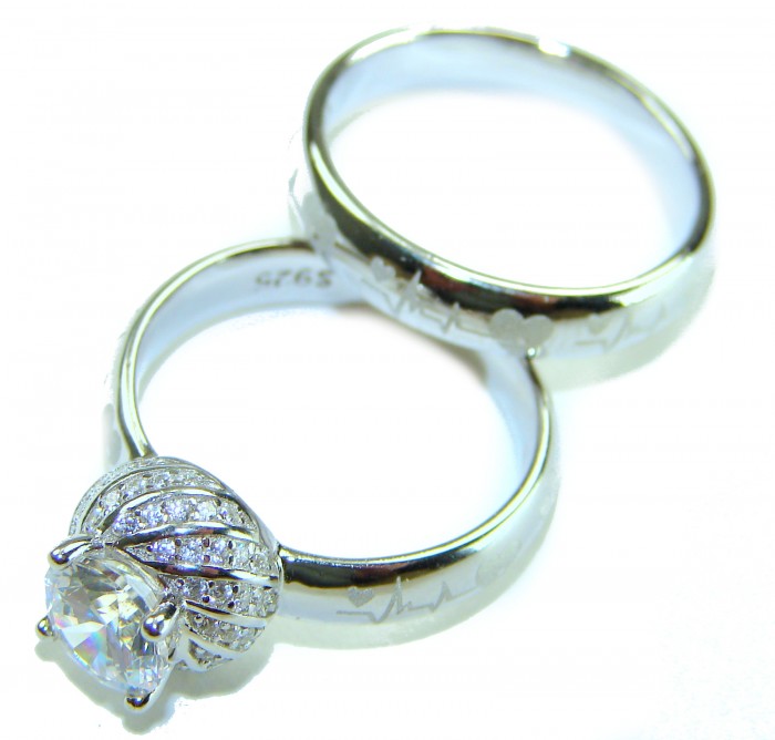 Spectacular 5.9 carat White Topaz Emerald .925 Sterling Silver stack up ring size 7 1/2 - Two sterling silver rings side view with topaz and engraved heart pattern.