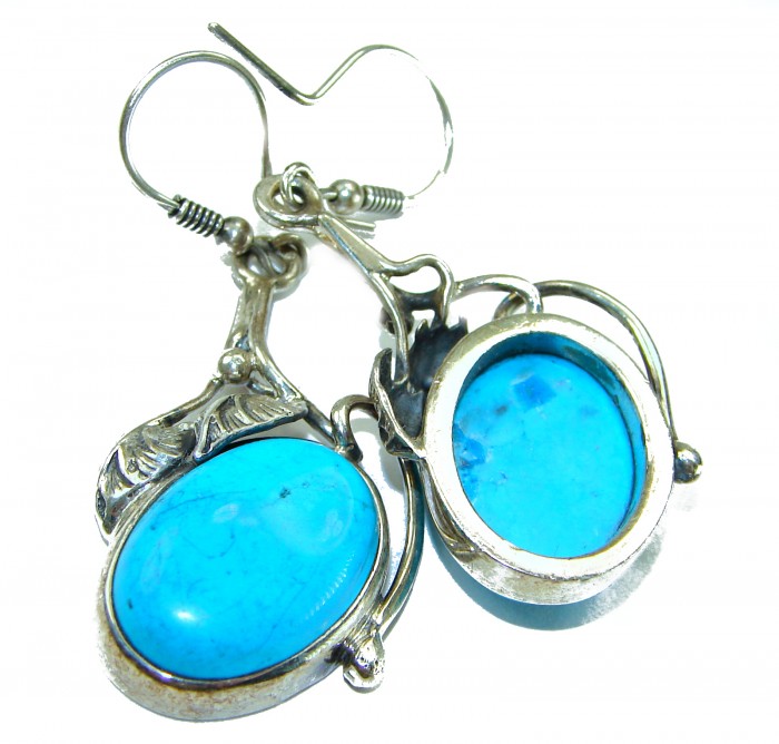 Great authentic Sleeping Beauty Turquoise .925 Sterling Silver handcrafted Earrings - Close-up of turquoise and silver earrings.