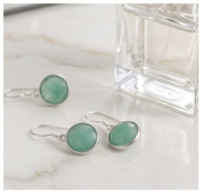 14.9 carat authentic Aquamarine .925 Sterling Silver Handcrafted Earrings - Aquamarine sterling silver earrings on marble surface, side view.