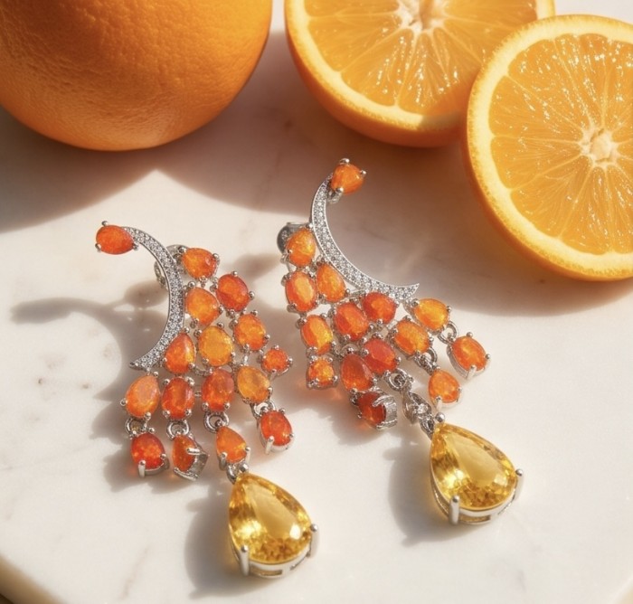 Valentina 3.9 carat Natural Fire Opal 4.9 carat Citrine rhodium over .925 Sterling Silver handcrafted earrings - Earrings with fire opals and citrines next to sliced orange, top view